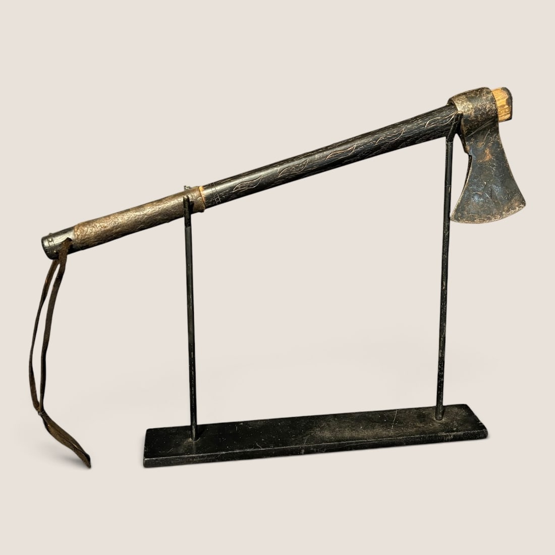 Native American Trade Axe With Brass Tacks: Measuring approx 16 inches with small brass tacks to top and bottom of haft, engraved designs to haft with a leather wrapped handle.We offer effecient & affordable in-house shipping on all items in th