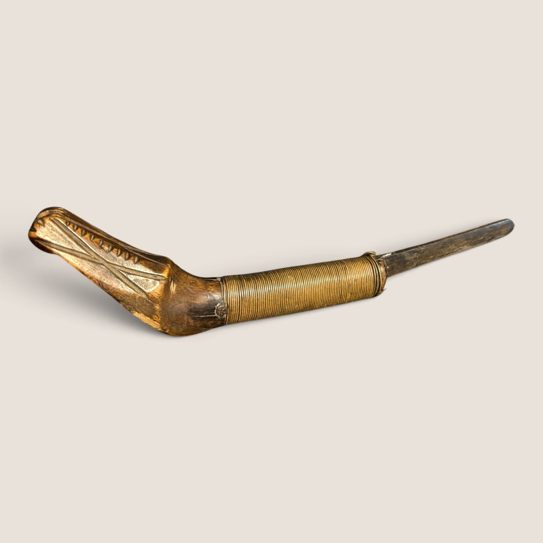 Superb Native American Crooked Knife: Wrapped with copper, carved designs to handle. Measuring approx 9 inches in length. Good condition.We offer effecient & affordable in-house shipping on all items in this auction. Bid directly at