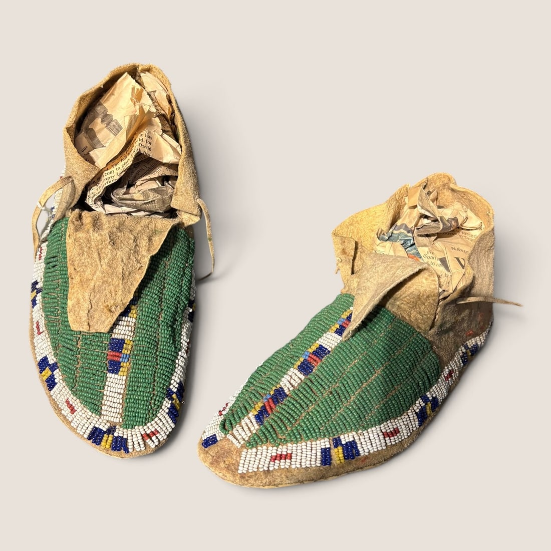 Sioux/Arapaho Adult Moccasins: Late 19th century, excellent condition. measuring approx 8.5 inches each.We offer effecient & affordable in-house shipping on all items in this auction. Bid directly at Bid.Ziebarths.com for our
