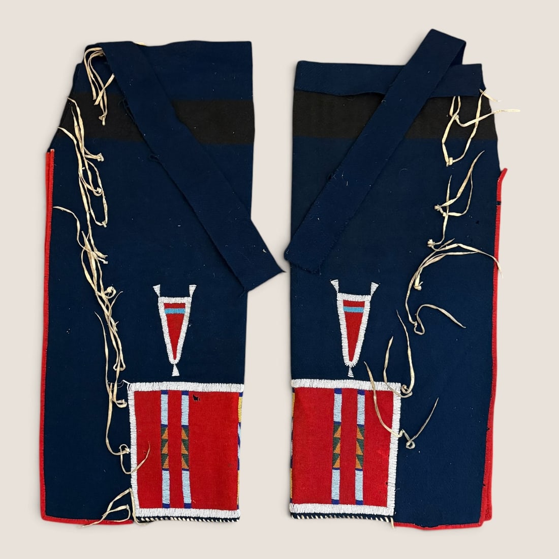 Fine Pair of Crow Leggings: Beaded on trade cloth, excellent condition. From a lifetime midwest collection. Measuring approx 32 x 14 inches. Of the highest quality.We offer effecient & affordable in-house shipping on all items