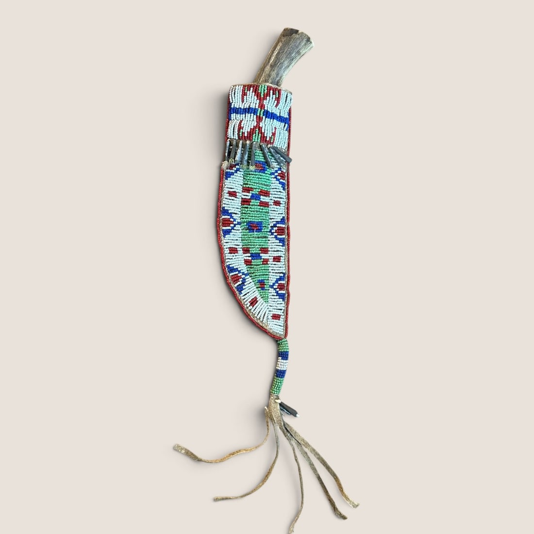 Sioux Knife Sheath & Knife: Measuring approx 14 inches from top to bottom of drop, with early trade knife intact.We offer effecient & affordable in-house shipping on all items in this auction. Bid directly at Bid.Ziebarths.com