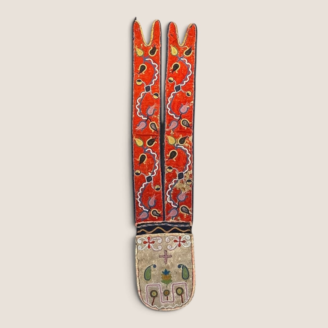 Circa 1860s Metis Cree Bandolier Bag/Shot Pouch: Measuring approx 32 inches in length x 6.5 inches across at the bag. Early trade beads, circa 1860s. A bright red trade cloth to the strap makes this bag exceptionally stunning. Some loss, and age