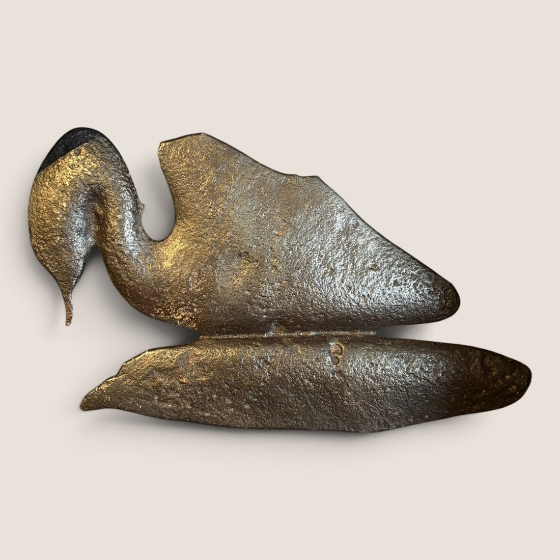 Early Antique Cast Iron Duck: Don't know it's purpose but an early cast iron duck shaped metal piece, 11 1/2 x 6 1/2, flat with hanging hook on back, very unusualWe offer effecient & affordable in-house shipping on all items in