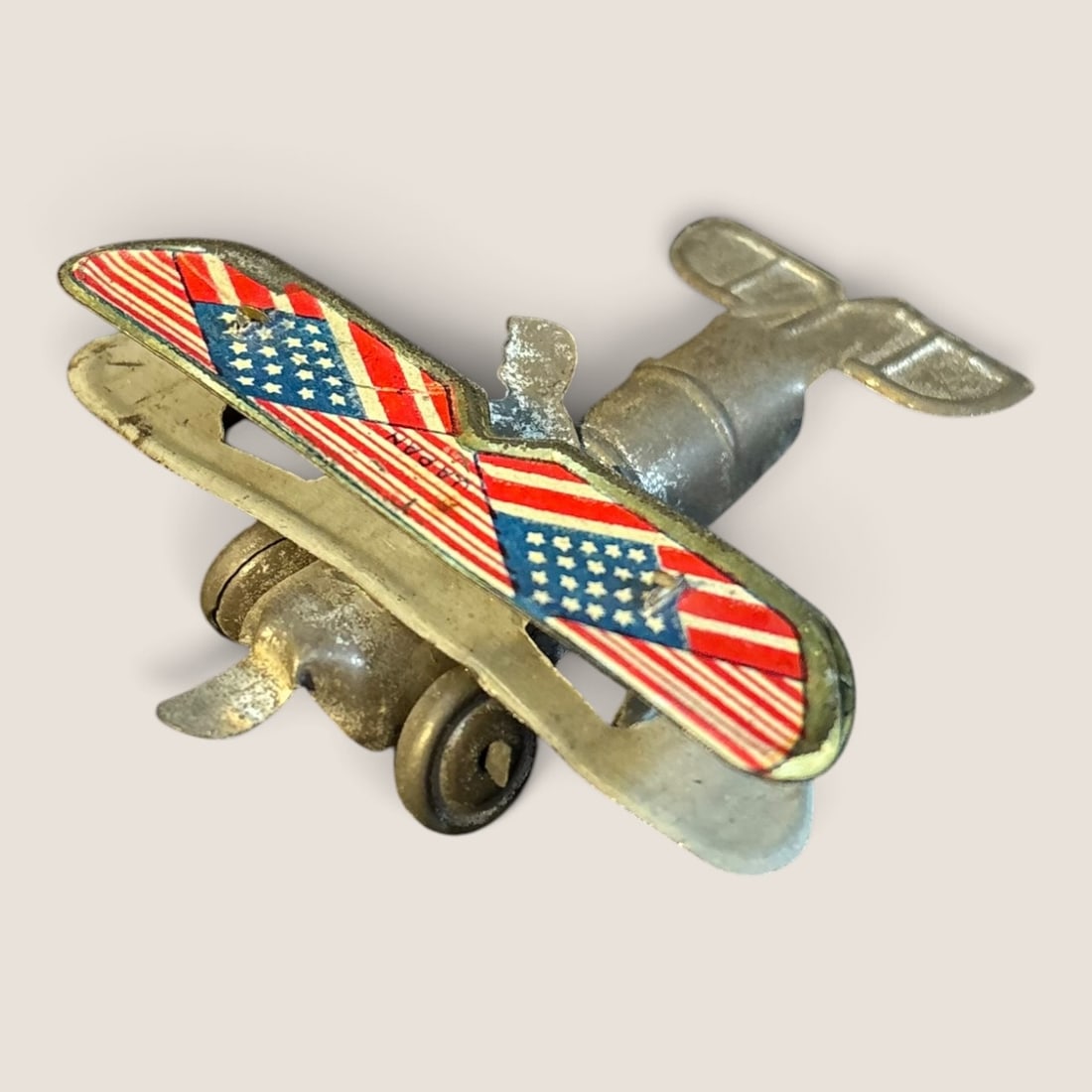 Early 1900's " American Bi Plane " Penny Toy: Early 1900's " American Bi Plane " Tin Penny toy, excellent original condition,We offer effecient & affordable in-house shipping on all items in this auction. Bid directly at Bid.Ziebarths.com for our