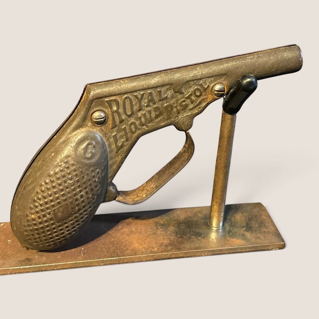 Antique Toy Pistol Marked " Royal Liquid Pistol ": Antique toy pistol marked " Royal Liquid Pistol ", 5 inch, missing triggerWe offer effecient & affordable in-house shipping on all items in this auction. Bid directly at Bid.Ziebarths.com for our lowe