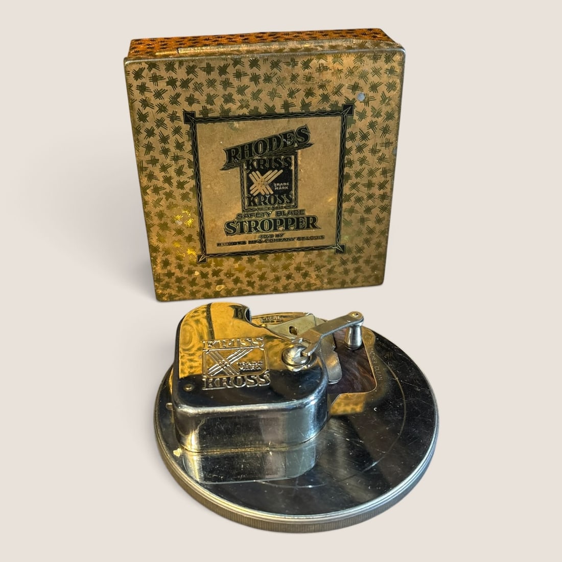 1900-19i20's " Kriss Kross Stropper " With Original Tin Case: Like new antique " Kriss Kross Stropper " with the original lithoed tin container, excellentWe offer effecient & affordable in-house shipping on all items in this auction. Bid directly at Bid.Ziebarth