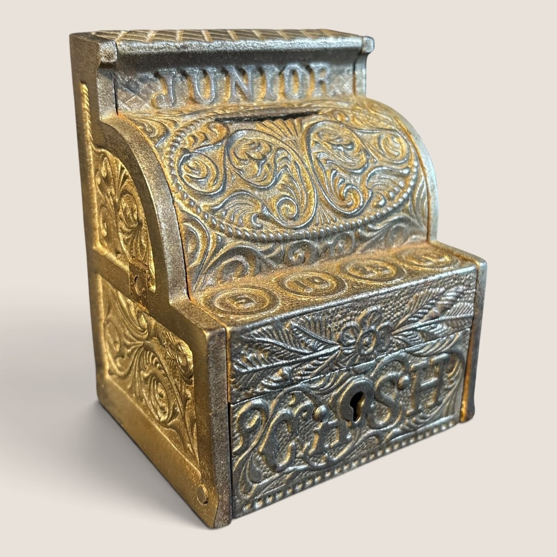 Rare J.& E. Stevens " Junior Cast Iron Cash Register Coin Bank ": A rare J.& E. Stevens cast iron cash register coin bank, excellent condition WITH KEY !, 3 1/2 x e3 x 4.We offer effecient & affordable in-house shipping on all items in this auction. Bid directly at 
