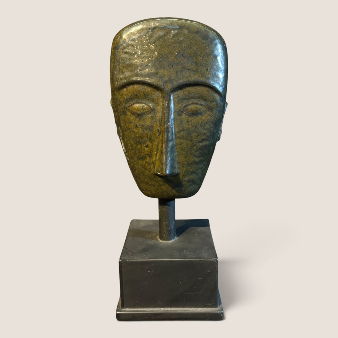 MCM Head Desktop Statue: Mid Century Modern Head statue, appears to be made of glass or thin ceramic, 13 1/2 tall, mounted on metal base, no other information knownWe offer effecient & affordable in-house shipping on all