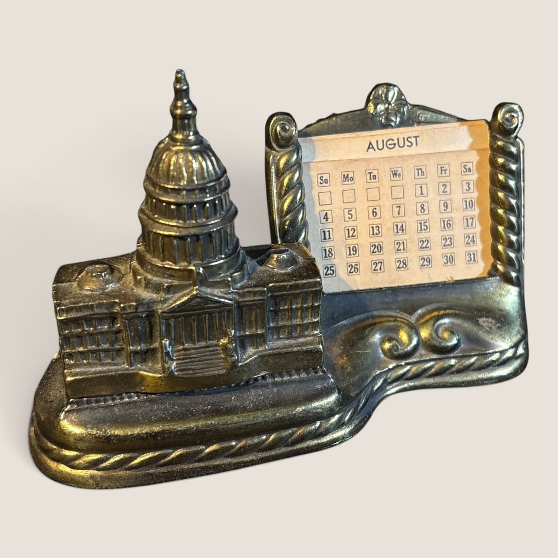 Vintage Mid Century Metal Souvenir Desk Calendar And Paperweight: A mid century metal desk calendar and paperweight, 6 inches long, excellentWe offer effecient & affordable in-house shipping on all items in this auction. Bid directly at Bid.Ziebarths.com for our low