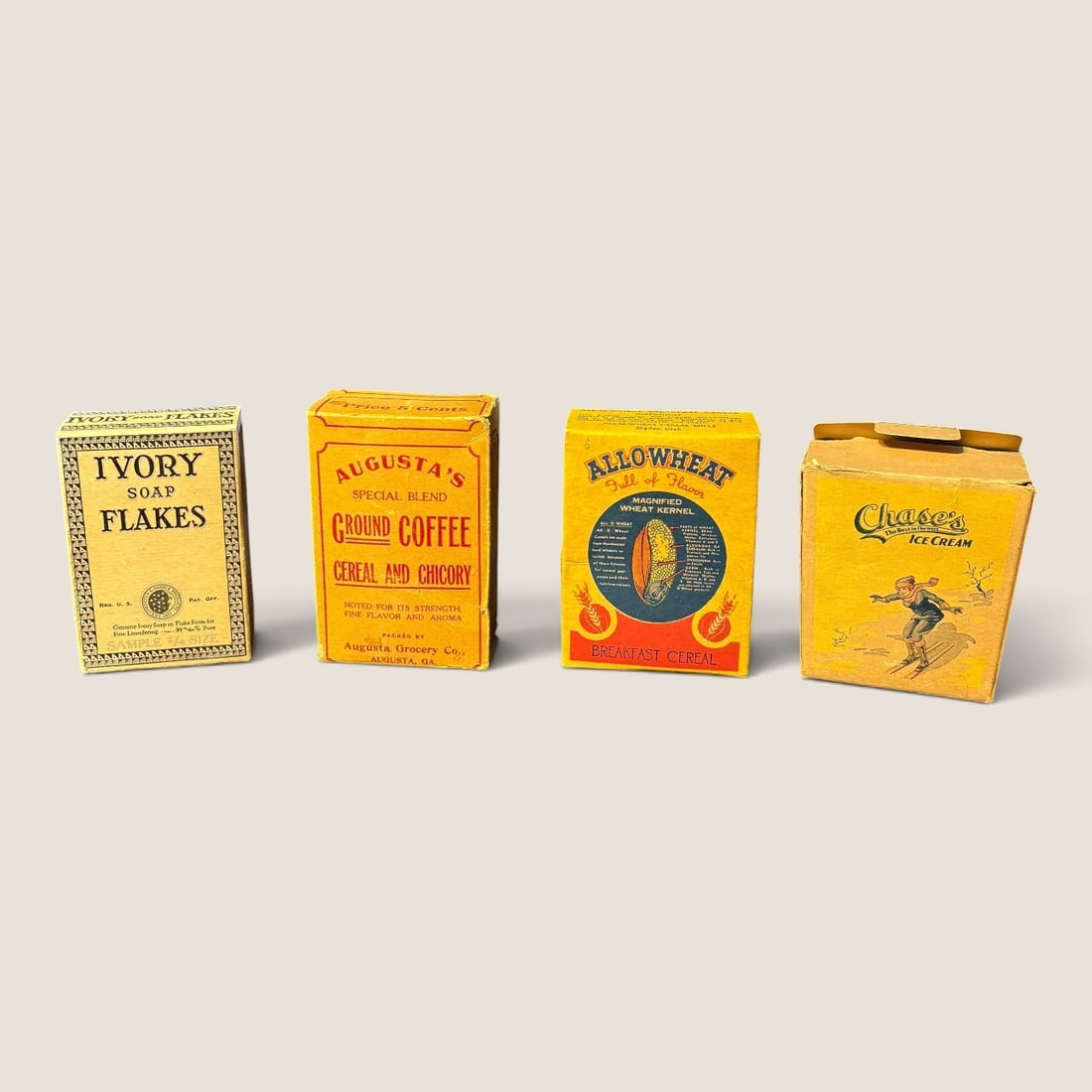 A Group of Vintage American Product Sample and Miniature Advertising Boxes: A group of four printed paperboard advertising boxes representing early to mid-20th-century American consumer products. The collection includes a mix of sample sizes and miniature retail packaging.The