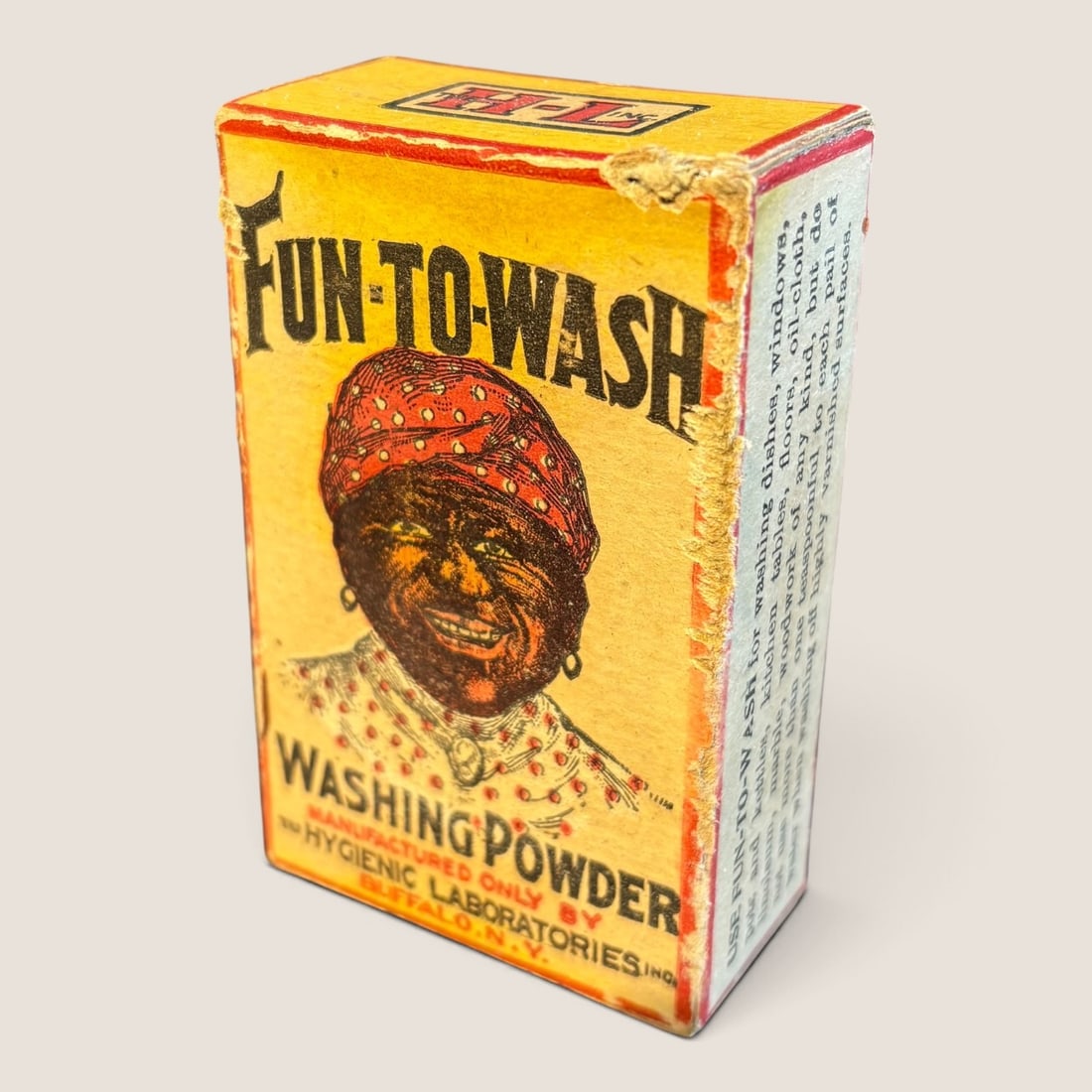 Hygienic Laboratories Inc. Fun-To-Wash Washing Powder Sample Box: A vintage cardboard sample box for Fun-To-Wash brand washing powder. The front panel features a central color illustration of a Black woman wearing a red head scarf with white polka dots and a matchin