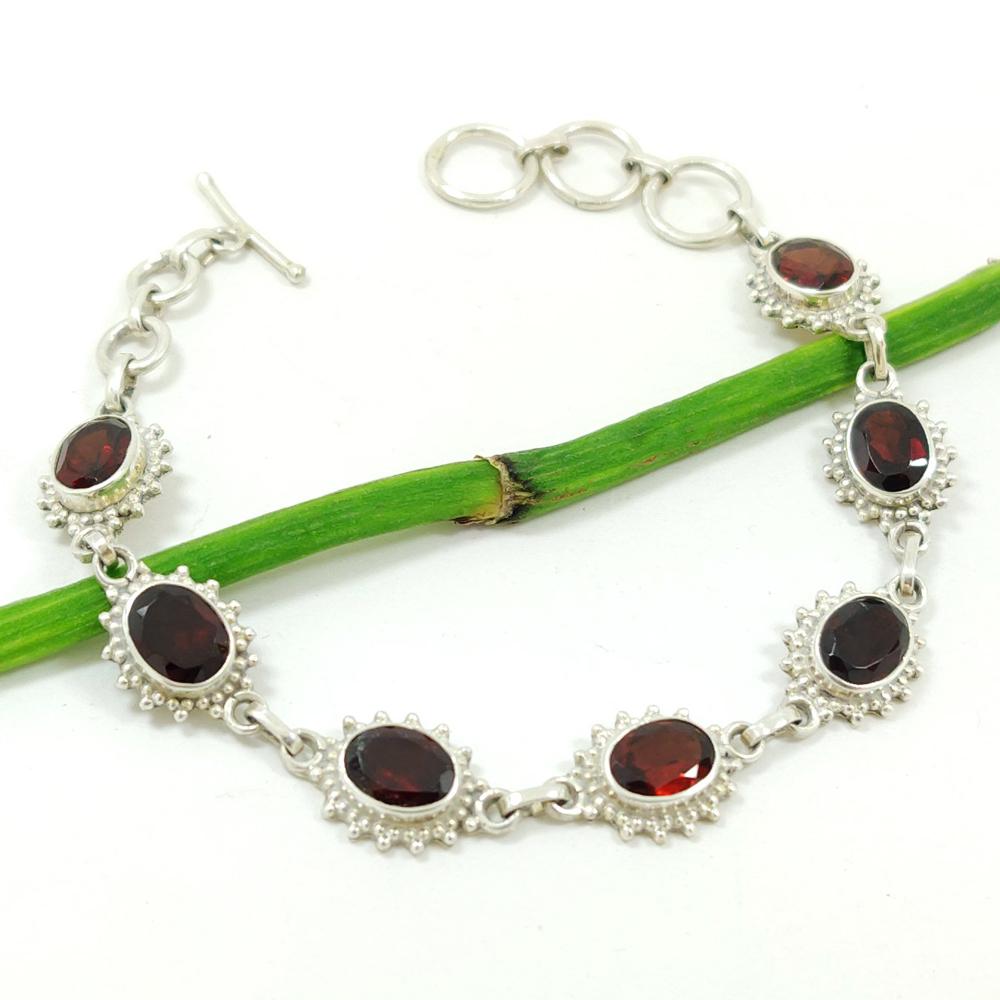 GARNET GEMSTONE 92.5 STERLING SILVER BRACELET: ITEM : BRACELET MAIN STONE : GARNET MAIN STONE SHAPE : OVAL MAIN STONE SIZE : 6X8 MM MAIN STONE COLOR : RED METAL : STERLING SILVER METAL PURITY : 92.5 BRACELET SIZE : 7.5" (WITH ADJUSTABLE LINK) INCH
