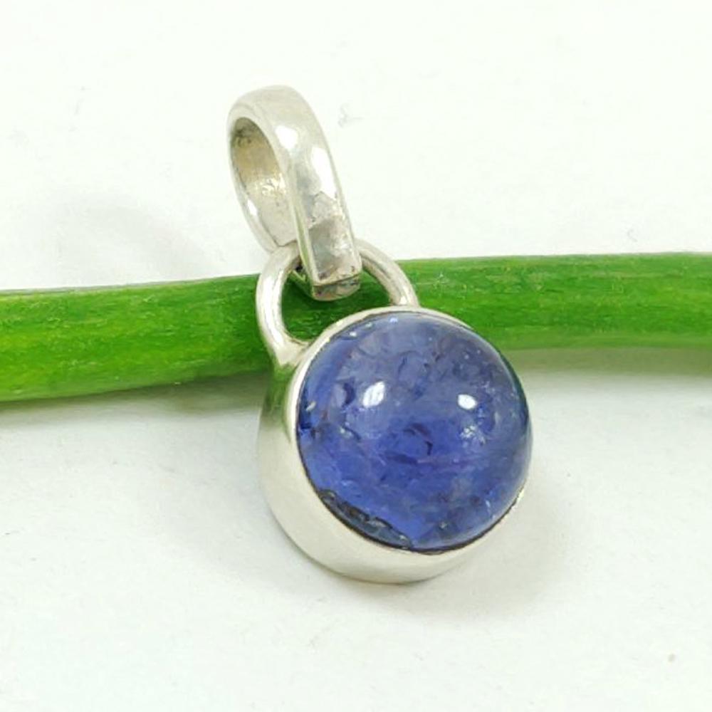 TANZANITE GEMSTONE 92.5 STERLING SILVER PENDANT: ITEM : PENDANT MAIN STONE : TANZANITE MAIN STONE SHAPE : ROUND MAIN STONE SIZE : 9X9 MM MAIN STONE COLOR : VOILET METAL : STERLING SILVER METAL PURITY : 92.5 PENDANT SIZE : 0.6 INCHES PENDANT WEIGHT :