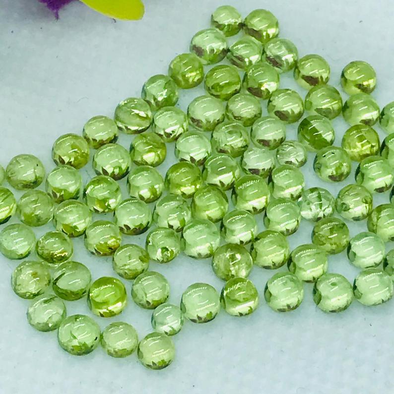 Natural Peridot 3 MM Round Cabochon 25 Pieces: Natural Peridot 3 MM Round Cabochon 25 Pieces Gemstone : Peridot Shape : Round Size : 3 MM Type : Cabochon Color : Green Quantity : 25 Pieces Weight : 4.5 Carats Country of Origin : Myanmar Country of