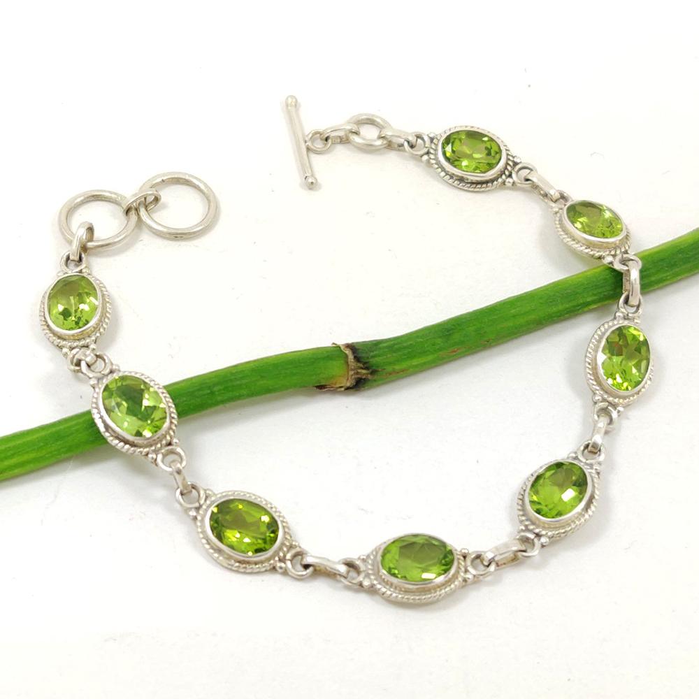 PERIDOT GEMSTONE 92.5 STERLING SILVER BRACELET: ITEM : BRACELET MAIN STONE : PERIDOT MAIN STONE SHAPE : OVAL MAIN STONE SIZE : 6X8 MM MAIN STONE COLOR : GREEN METAL : STERLING SILVER METAL PURITY : 92.5 BRACELET SIZE : 7.5" (WITH ADJUSTABLE LINK) I