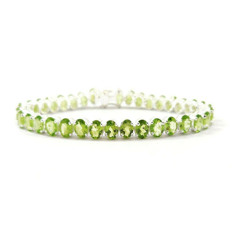 PERIDOT 92.5 STERLING SILVER TENNIS BRACELET: ITEM : BRACELET BRACELET TYPE : TENNIS MAIN STONE : PERIDOT MAIN STONE SHAPE : OVAL MAIN STONE SIZE : 7X5 MM MAIN STONE COLOR : GREEN METAL : STERLING SILVER METAL PURITY : 92.5 BRACELET SIZE : 7.5" G