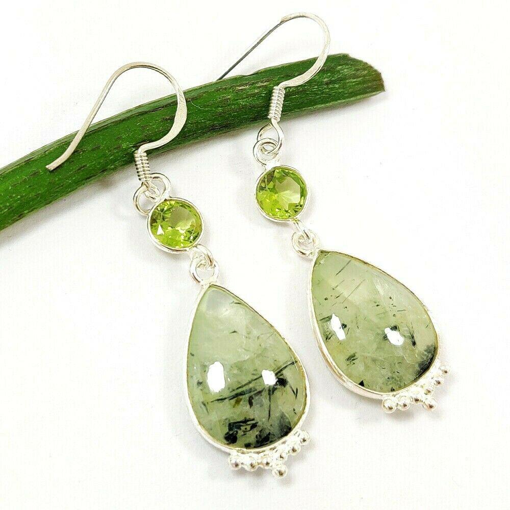 PREHNITE & PERIDOT 92.5 STERLING SILVER EARRING: PREHNITE & PERIDOT 92.5 STERLING SILVER EARRING Product Type : EARRING Main Stone : PREHNITE, PERIDOT Main Stone Shape : PEAR Main Stone Size : 17X13 MM Main Stone Color : MULTICOLOR Metal : STERLING 