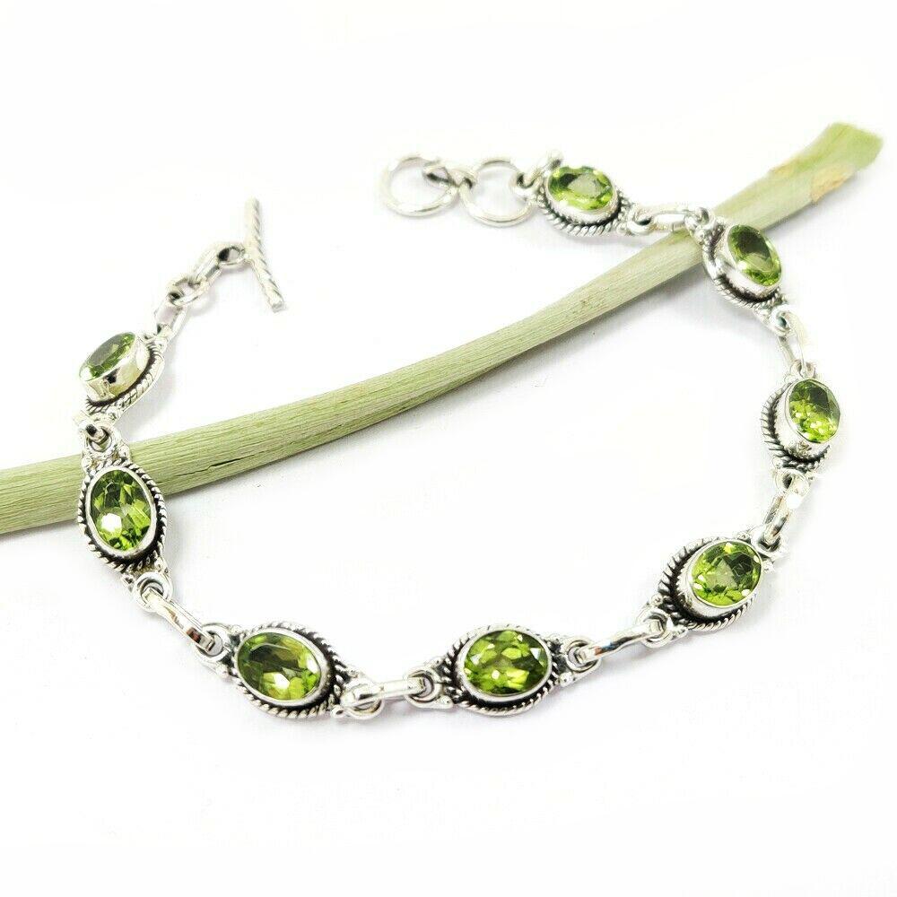 PERIDOT 92.5 STERLING SILVER BRACELET: PERIDOT 92.5 STERLING SILVER BRACELET Product Type : BRACELET Main Stone : PERIDOT Main Stone Shape : OVAL Main Stone Size : 7X5 MM Main Stone Color : GREEN Metal : STERLING SILVER Metal Purity : 92.5