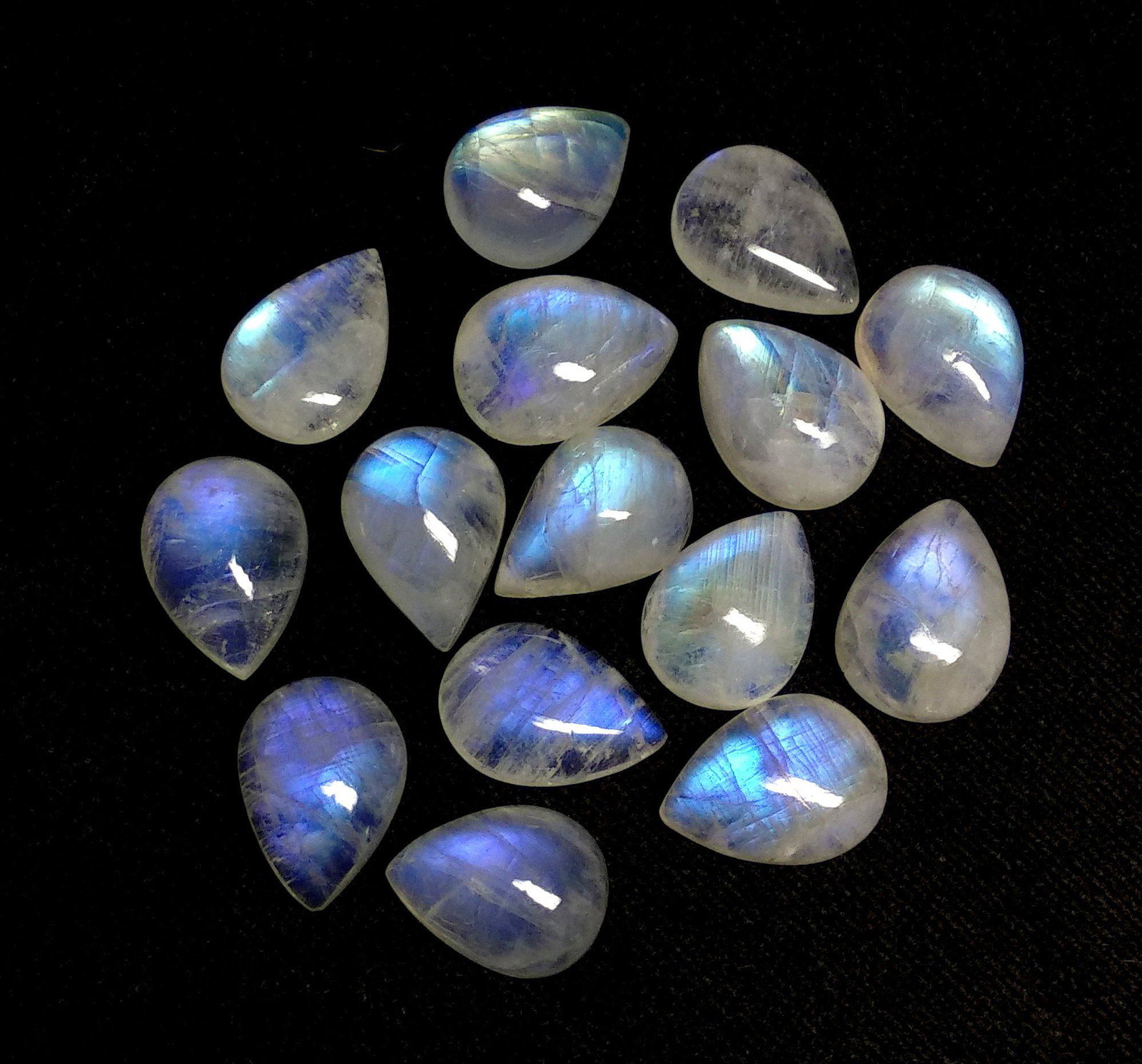 Natural Rainbow Moonstone 13x9 MM Pear Cabochon 17: Natural Rainbow Moonstone 13x9 MM Pear Cabochon 17 Pieces Gemstone : Rainbow Moonstone Shape : Pear Size : 13x9 MM Type : Cabochon Color : Rainbow Quantity : 17 Pieces Weight : 73.7 Carats Country of 