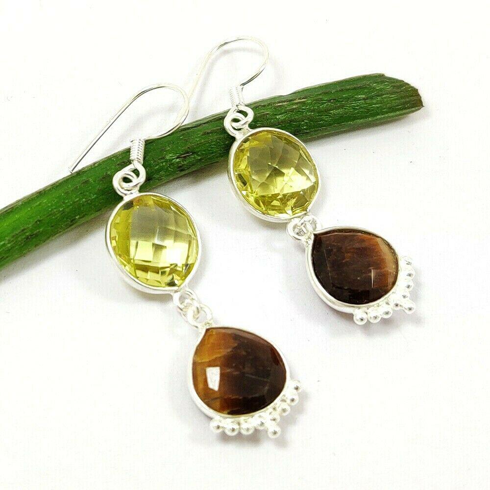 TIGER'S EYE & LEMON 92.5 STERLING SILVER EARRING: TIGER'S EYE & LEMON 92.5 STERLING SILVER EARRING Product Type : EARRING Main Stone : TIGER'S EYE, LEMON Main Stone Shape : PEAR Main Stone Size : 9X9 MM Main Stone Color : MULTICOLOR Metal : STERLING 
