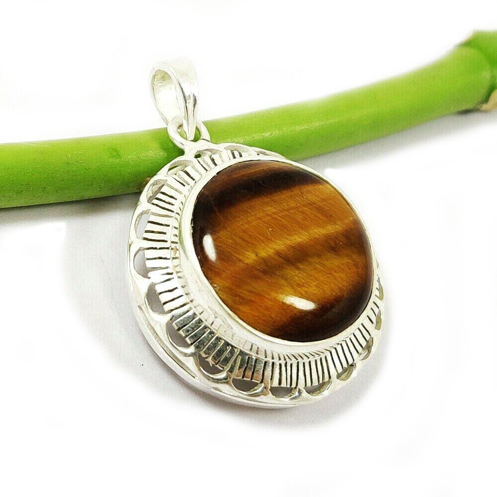 TIGER'S EYE GEMSTONE 925 STERLING SILVER PENDANT: TIGER'S EYE GEMSTONE 925 STERLING SILVER PENDANT Product Type : PENDANT Main Stone : TIGER'S EYE Main Stone Shape : ROUND Main Stone Size : 20X20 Main Stone Color : BROWN Metal : STERLING SILVER Metal