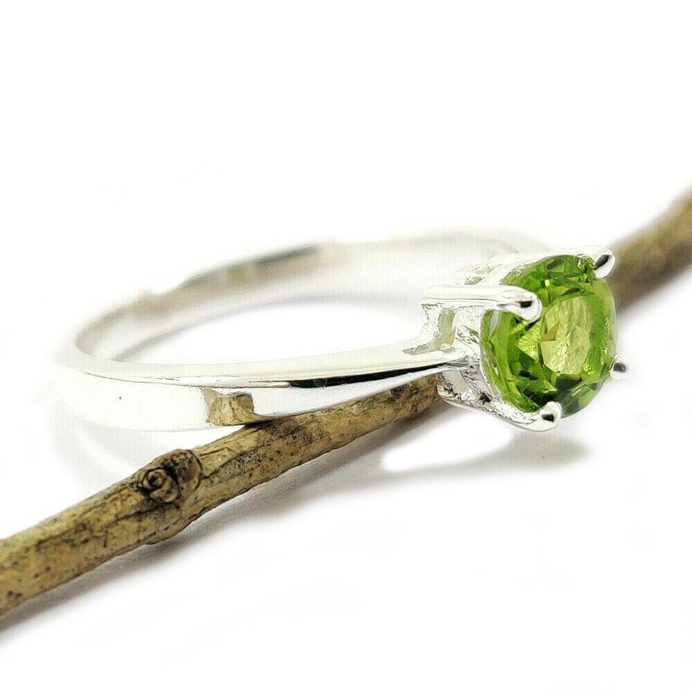 PERIDOT GEMSTONE STERLING SILVER RING: NATURAL PERIDOT GEMSTONE 925 STERLING SILVER HANDMADE RING JEWELRY GEMSTONE : PERIDOT STONE SHAPE : ROUND STONE SIZE : 6 MM METAL : STERLING SILVER METAL PURITY : 925 RING SIZE : AVAILABLE SIZES ( US 