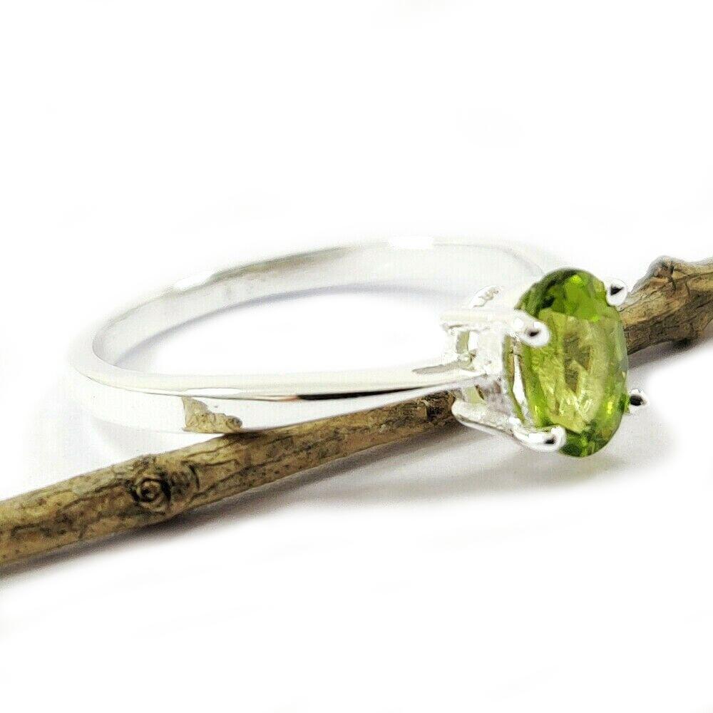 PERIDOT GEMSTONE STERLING SILVER RING: NATURAL PERIDOT GEMSTONE 925 STERLING SILVER HANDMADE RING JEWELRY GEMSTONE : PERIDOT STONE SHAPE : OVAL STONE SIZE : 7X5 MM METAL : STERLING SILVER METAL PURITY : 925 RING SIZE : AVAILABLE SIZES ( US
