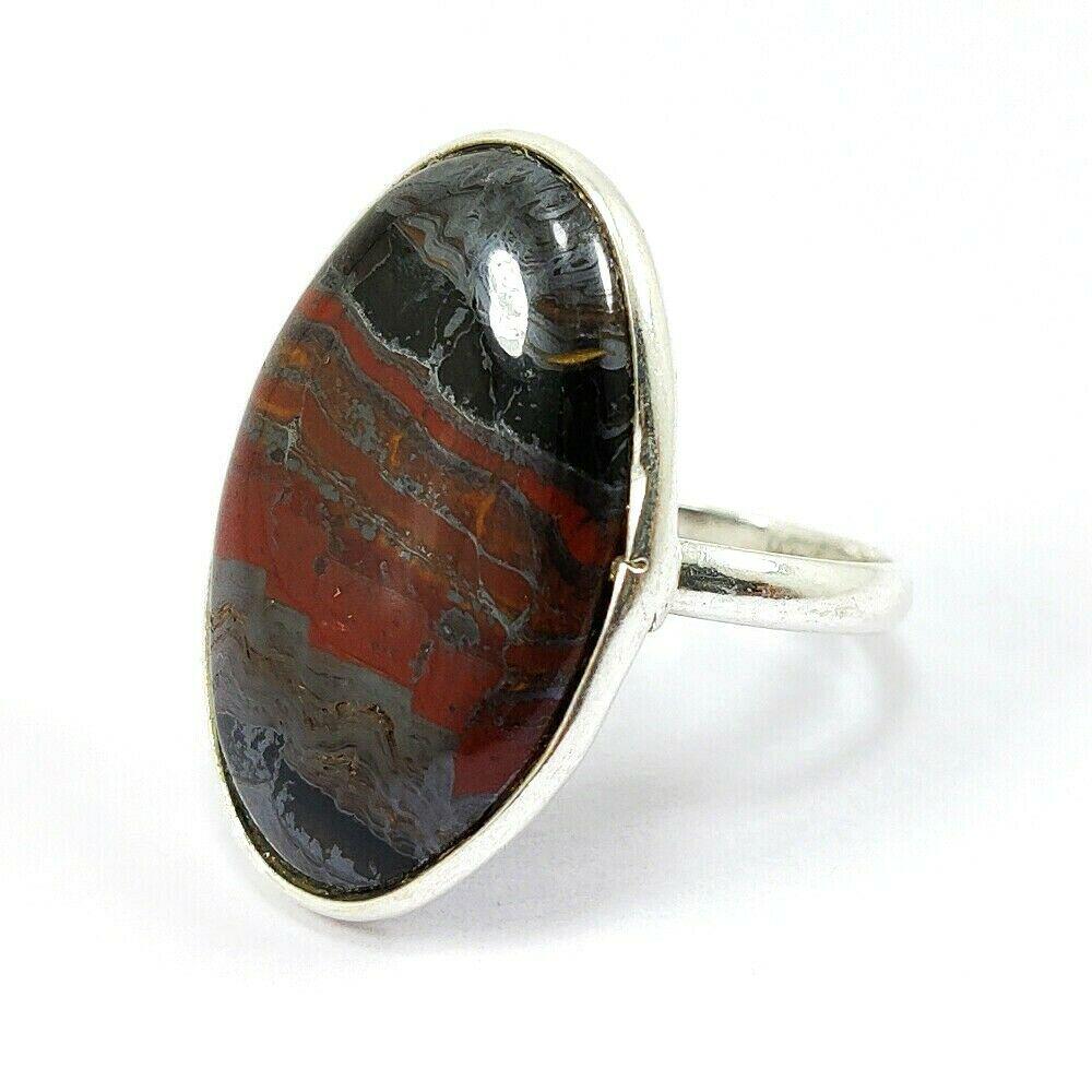 NATURAL IRON TIGER GEMSTONE 92.5 STERLING SILVER RING: NATURAL IRON TIGER GEMSTONE 92.5 STERLING SILVER RING Product Type : RING Main Stone : IRON TIGER Main Stone Shape : OVAL Main Stone Size : 26X17 MM Main Stone Color : MULTICOLOR Metal : STERLING SILV