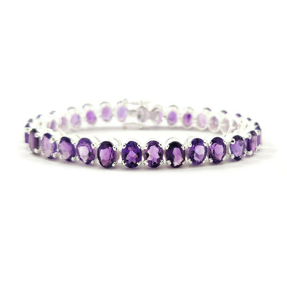 AMETHYST 925 STERLING SILVER TENNIS BRACELET: ITEM : BRACELET BRACELET TYPE : TENNIS MAIN STONE : AMETHYST MAIN STONE SHAPE : OVAL MAIN STONE SIZE : 7X5 MM MAIN STONE COLOR : PURPLE METAL : STERLING SILVER METAL PURITY : 925 BRACELET SIZE : 6" GE