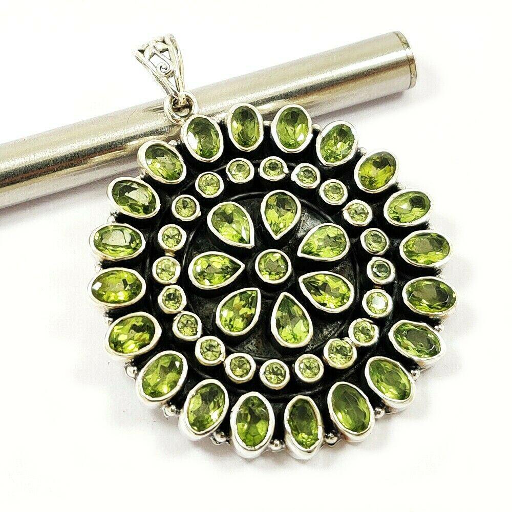 PERIDOT 92.5 STERLING SILVER PENDANT: PERIDOT 92.5 STERLING SILVER PENDANT Product Type : PENDANT Main Stone : PERIDOT Main Stone Color : GREEN Metal : STERLING SILVER Metal Purity : 92.5 Pendant Size : 2.2" Inches Pendant Weight : 24.9 G