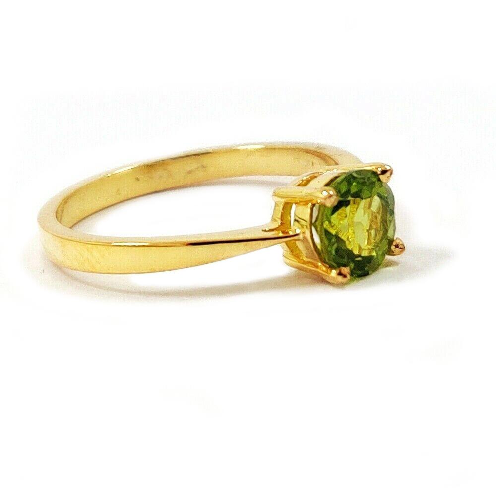 PERIDOT GEMSTONE 14KT YELLOW GOLD RING: NATURAL PERIDOT GEMSTONE 14 KT YELLOW GOLD HANDMADE RING JEWELRY GEMSTONE : PERIDOT STONE SHAPE : ROUND STONE SIZE : 6 MM METAL : YELLOW GOLD METAL PURITY : 14 KT RING SIZE : AVAILABLE SIZES ( US 6/7/