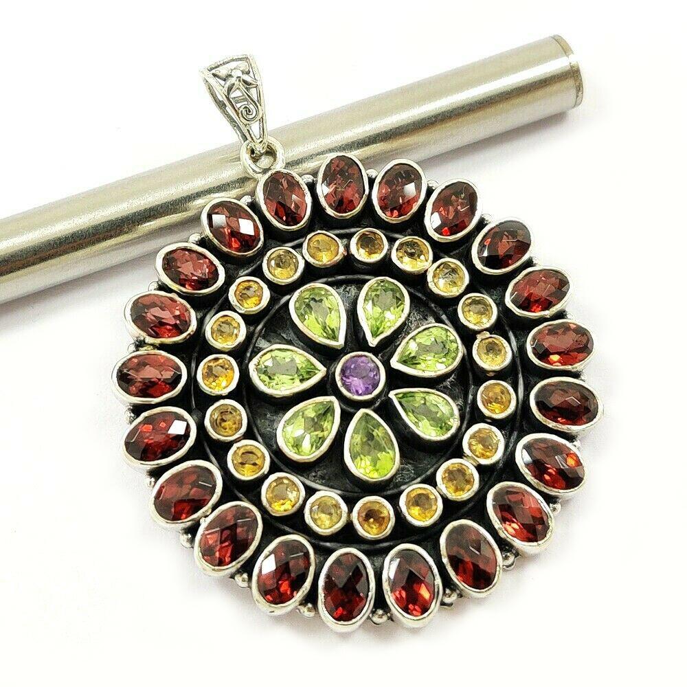 MULTI GEMSTONE 92.5 STERLING SILVER PENDANT: GARNET,CITRINE,PERIDOT,AMETHYST 92.5 STERLING SILVER PENDANT Product Type : PENDANT Main Stone : GARNET,CITRINE,PERIDOT,AMETHYST Main Stone Color : MULTICOLOR Metal : STERLING SILVER Metal Purity : 92