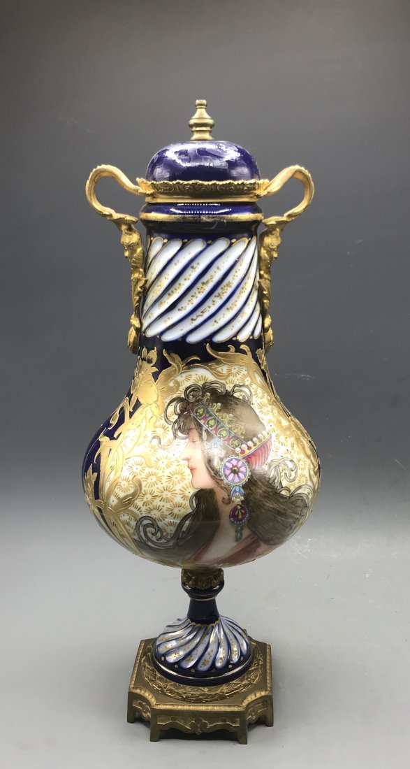 French Porcelain Vase: French porcelain vase, late 19th - early 20th C., decorated with gilt ormolu art work, Height: 18.5"