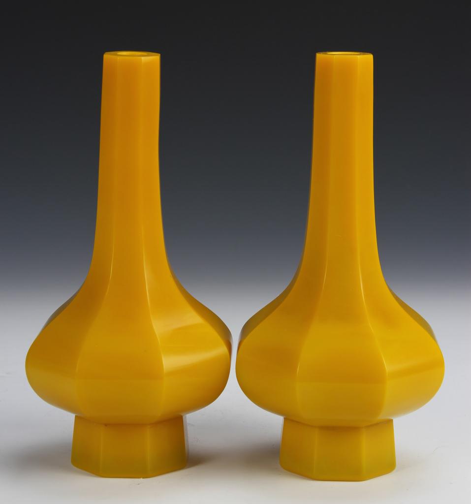 Pair of 19th C Chinese Peking Glass Vases: China, 19th C., pair of Peking eight-sided glass vases in opaque yellow-orange hue, with long neck and prominent foot. Height 7 1/2 in.