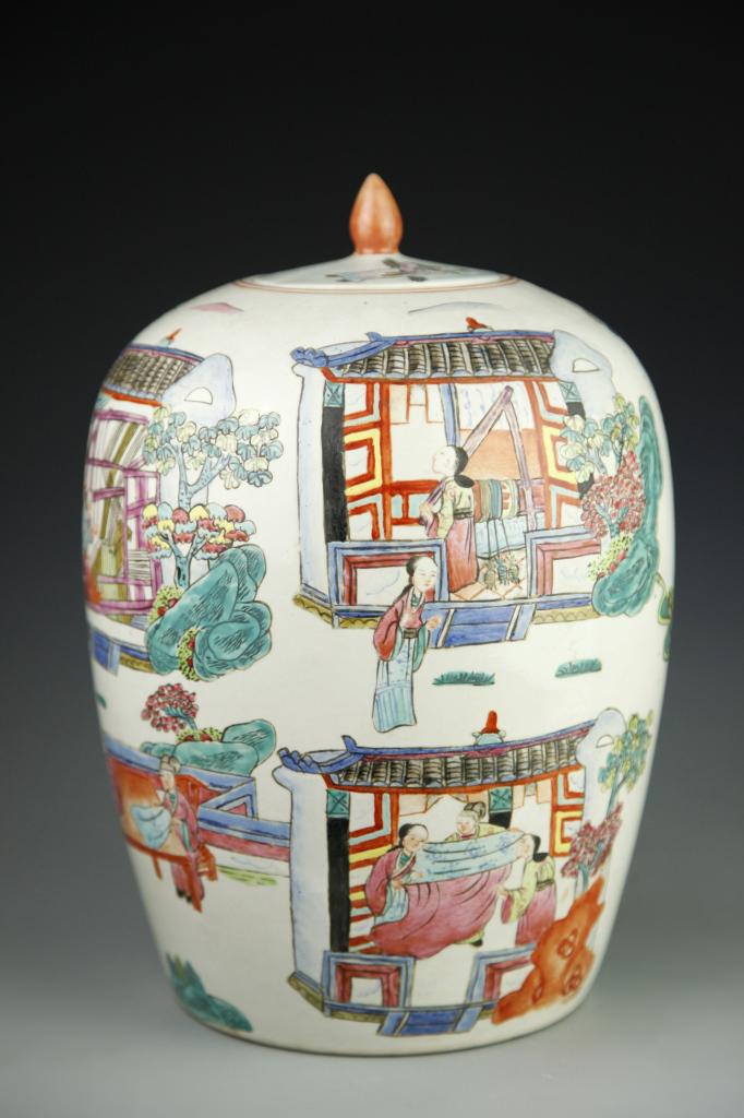 Chinese Famille Rose Jar: China, ROC, Famille Rose jar, wide shoulders, sides tapering to flat base, with fitted lid boosting a pointed orange finial, painted scenes depicting women at work in a home. Height 12 in.