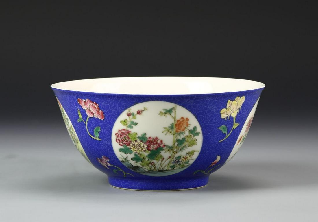 Chinese Famille Rose Bowl: China, 19th C., Famille Rose bowl, center image of a mythical bird with wings outstretched flying to peaches, exterior sides decorated with floral emblems against blue ground, with Jia Qin mark. Diame