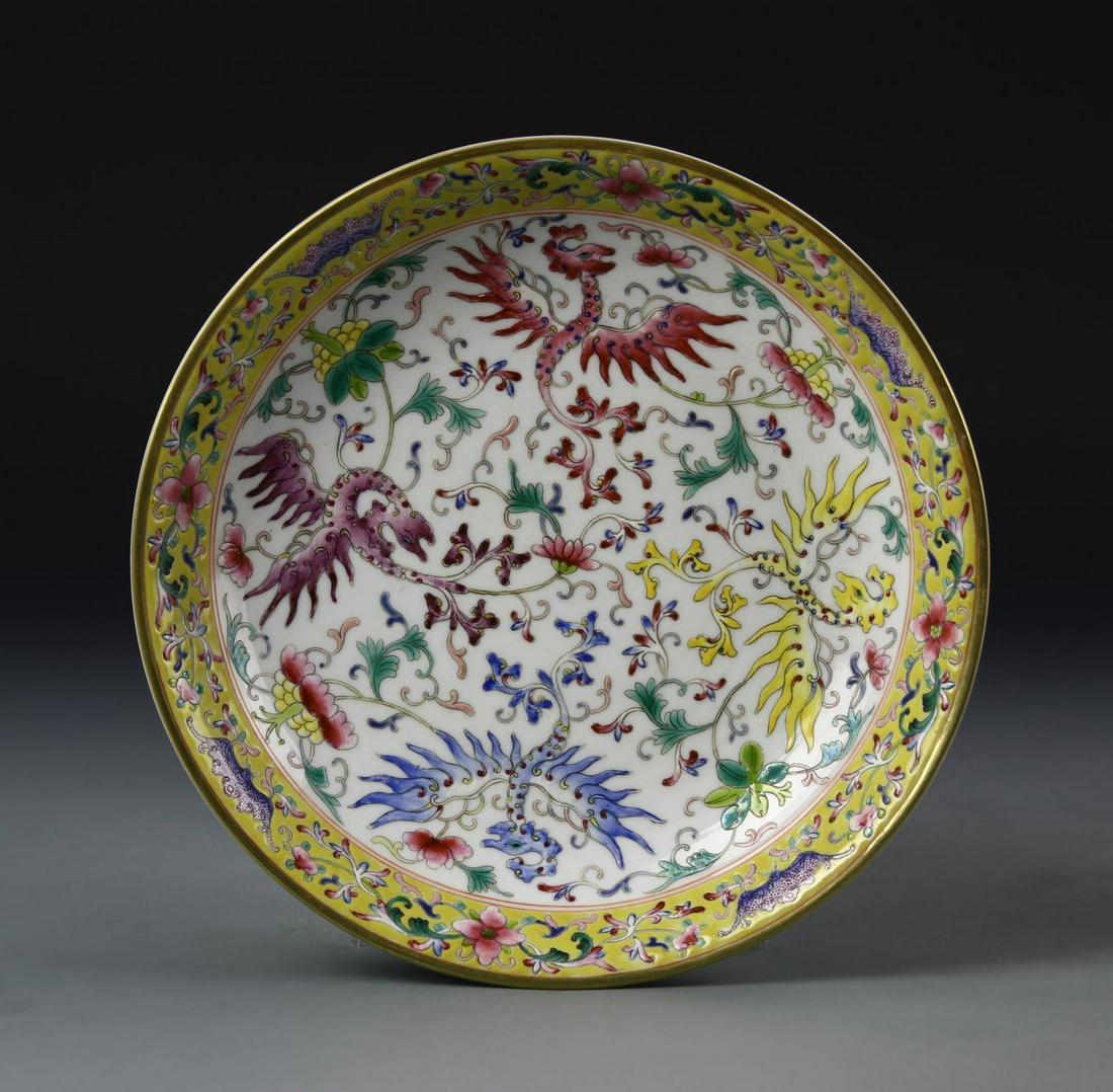 Chinese Famille Rose Plate: China, 19th C, Famille Rose plate, center design of mythical birds in bright colors with a floral border around the rim, Guangxu mark on underside. Diameter 8 in.