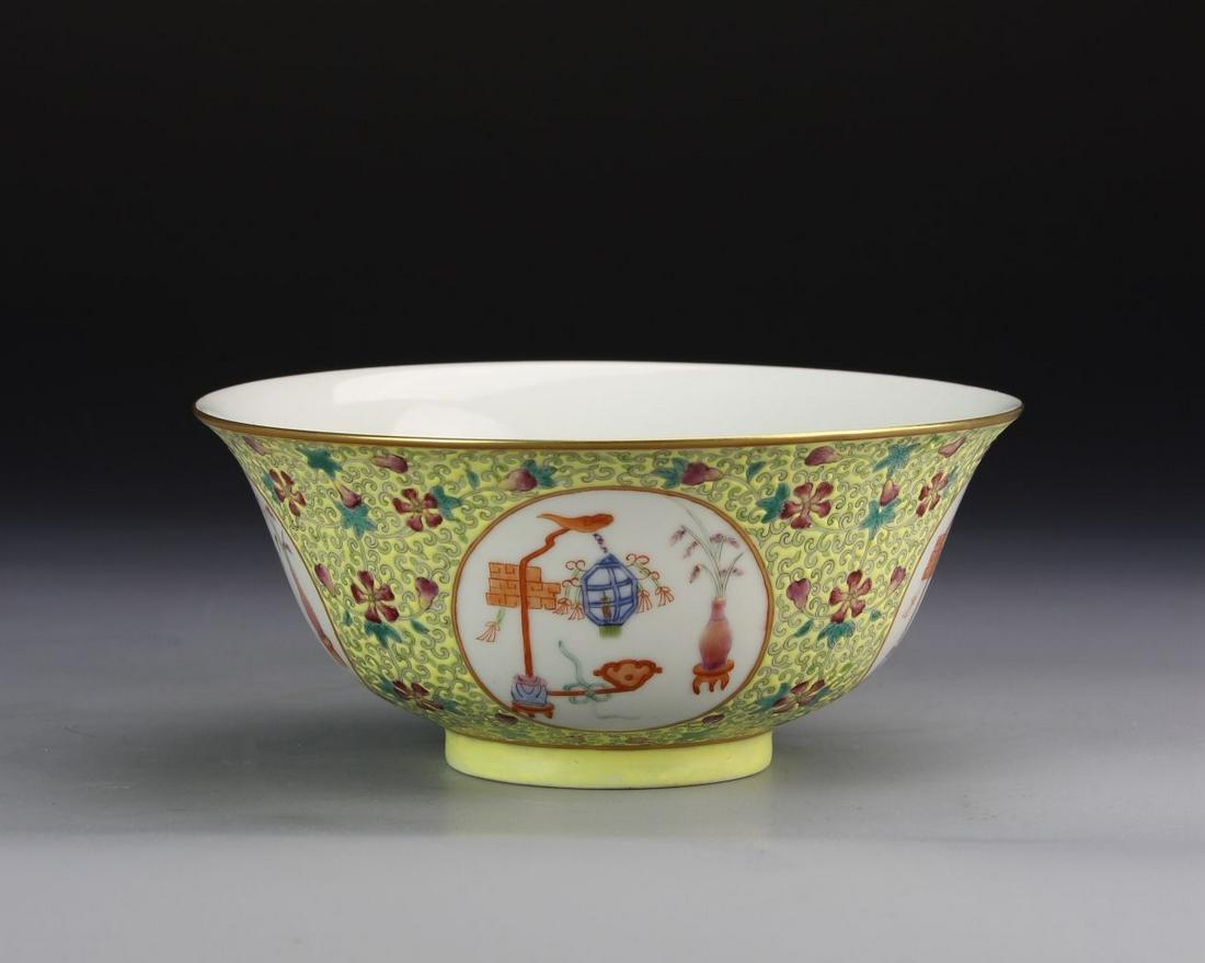 Chinese Famille Rose Bowl: China, 19th C., Famille Rose bowl, with bright yellow ground, high density, colorful floral motifs, white circular windows with scenes including potted flowers and other house objects, and white glaze
