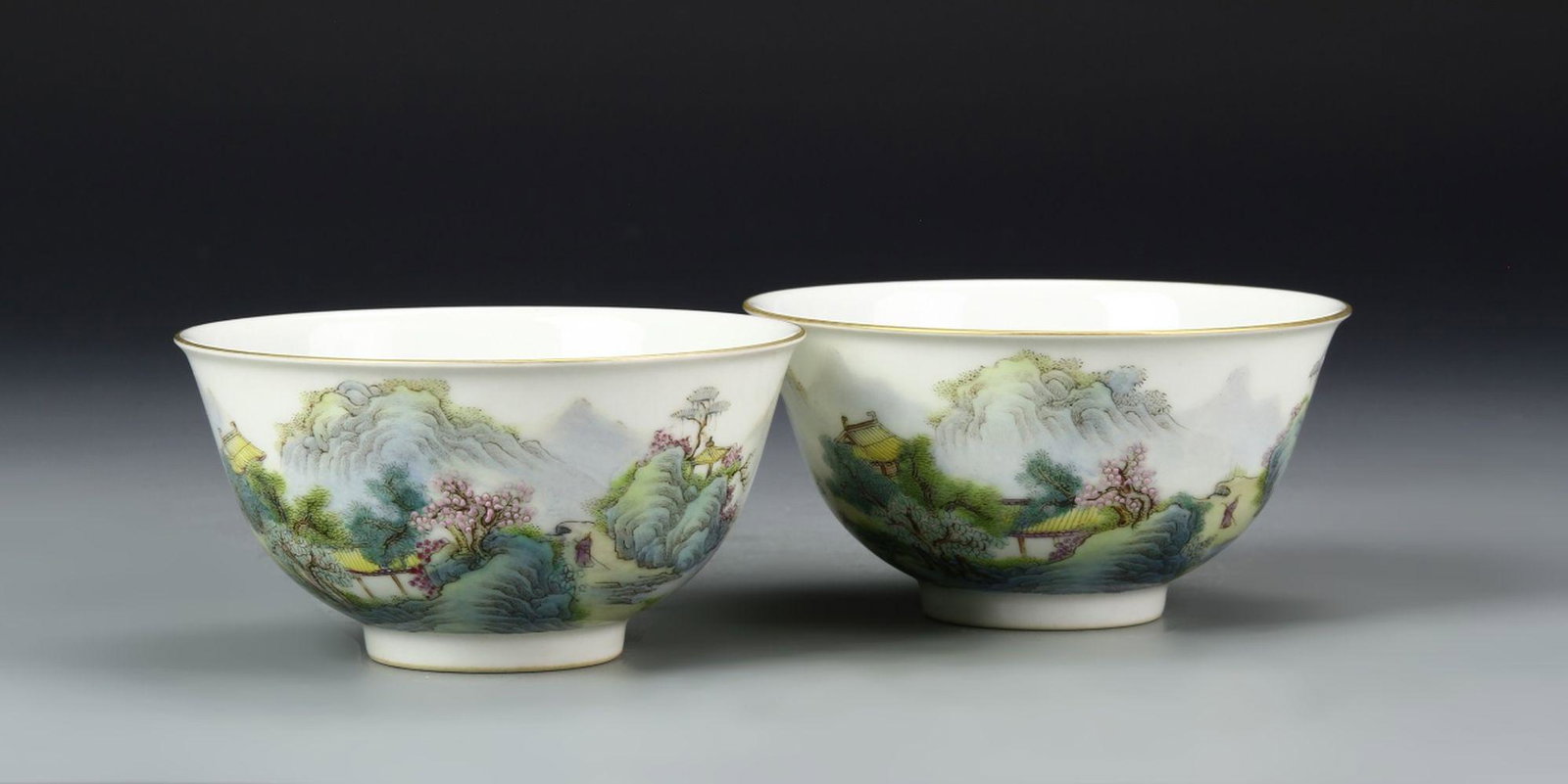 Pair of Chinese Famille Rose Bowls: China, ROC Period, pair of Famille Rose bowls, foot base, nature motif, hues of green, blue and pink Guangxu mark. Diameter 4 1/2 in., Height 2 1/4 in.