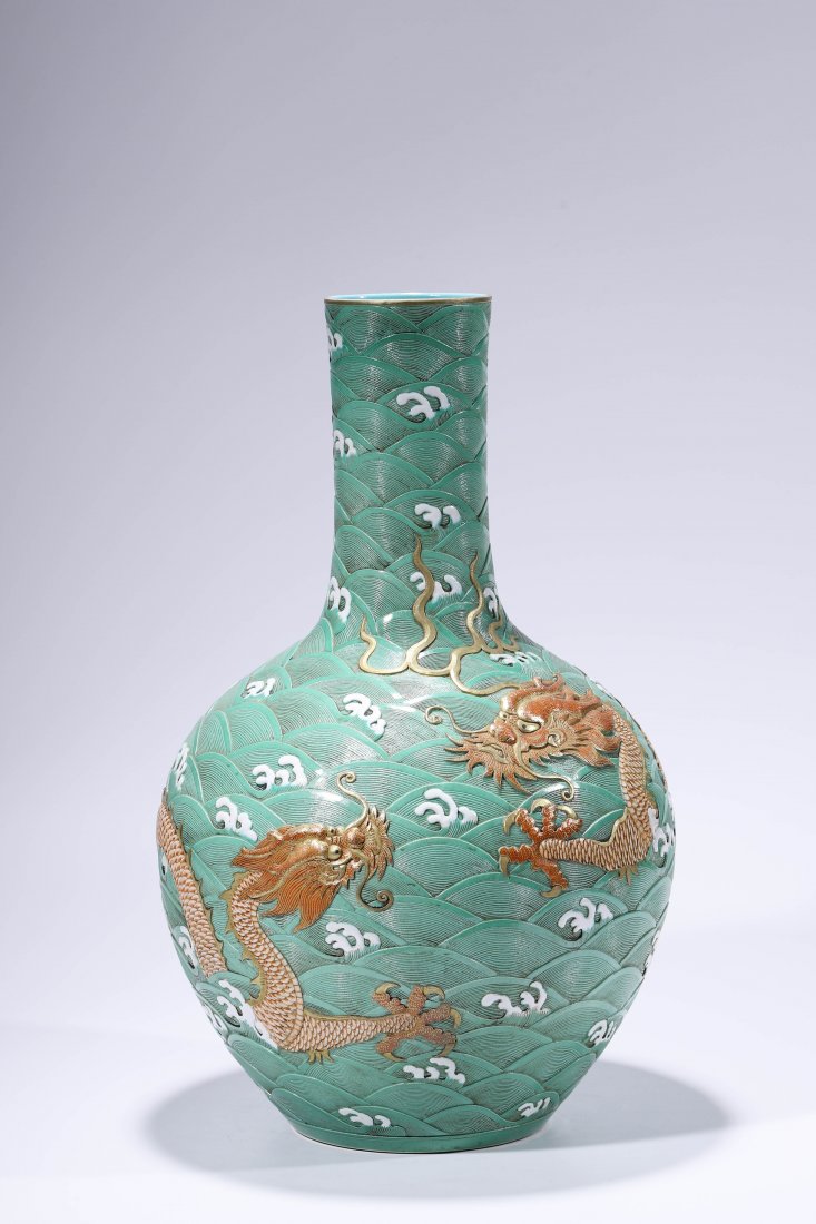 Chinese Porcelain Iron-Red-Glazed and Gilt-Inlaid: China. Qing Dynasty Qian Long Period. A red-glazed and gilt-inlaid vase. W:13.87in H:22.58in