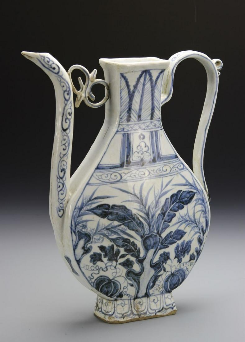 Chinese Blue and White Wine Pot: China, Yuan-Ming Period, blue and white wine pot, in a flattened form, decorated with floral and leaf motifs on the lower part, missing cover. Height 9 1/2 in. Width 8 1/8 in.