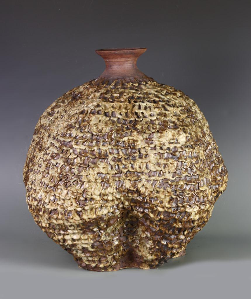 Artistic Pottery Jar Studio: Artistic pottery jar studio, two toned brown and beige colors with raised sculpting. Height 20 in., Width 18 1/2 in.