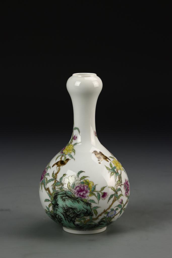 Chinese Famille Rose Garlic Head Vase: China, Qing dynasty, Famille Rose garlic head vase, blossoming flowers in purples and yellows grow from the rocks with small brown birds, calligraphy on one side and Yongzheng mark on base. Height 6 3