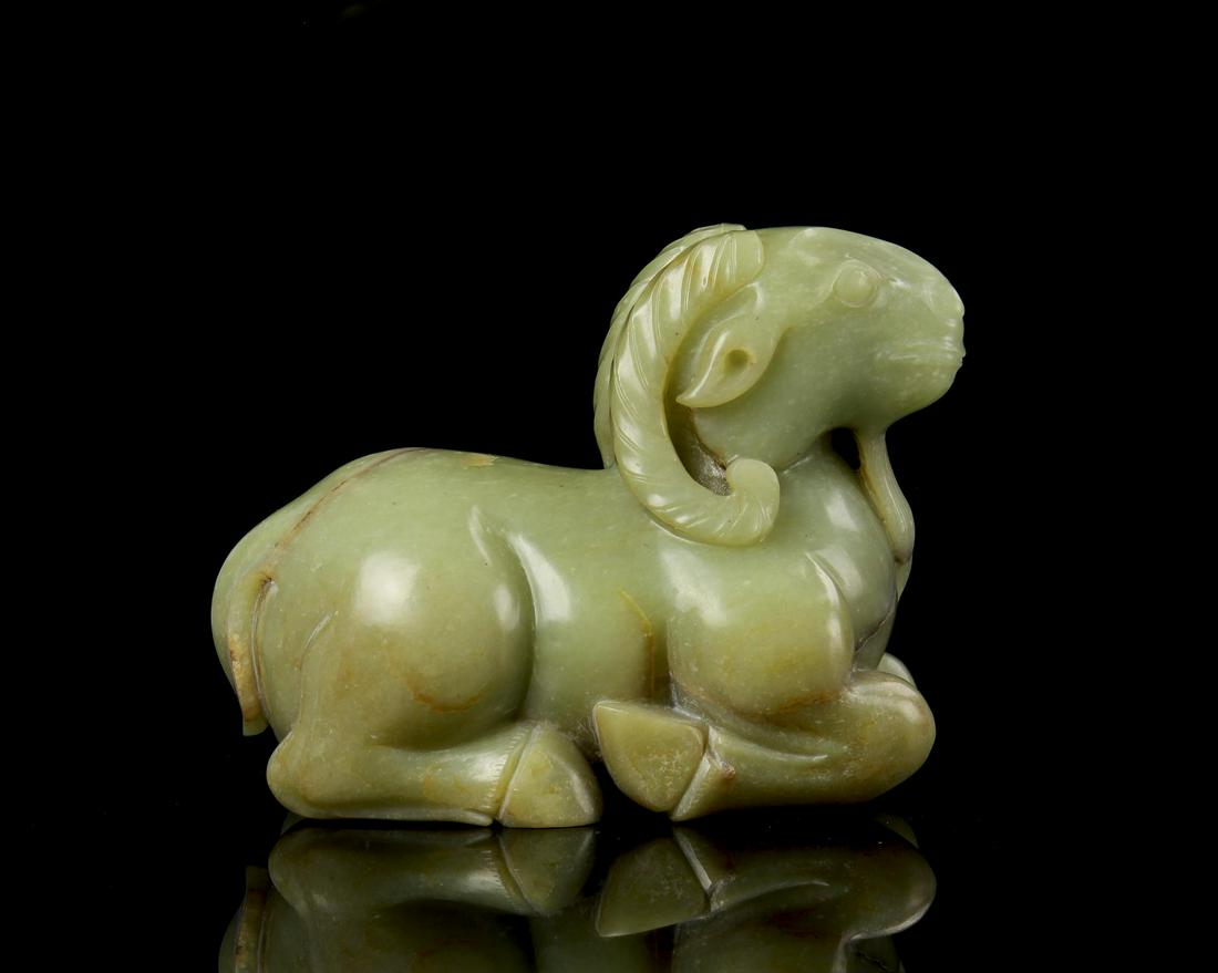 Chinese Jade Ram: China, Ming Period, jade ram, in lying position simplistically rendered, expertly carved horns and beard, hue of sea foam-green. Height 4 1/8 in., Length 3 1/4 in.