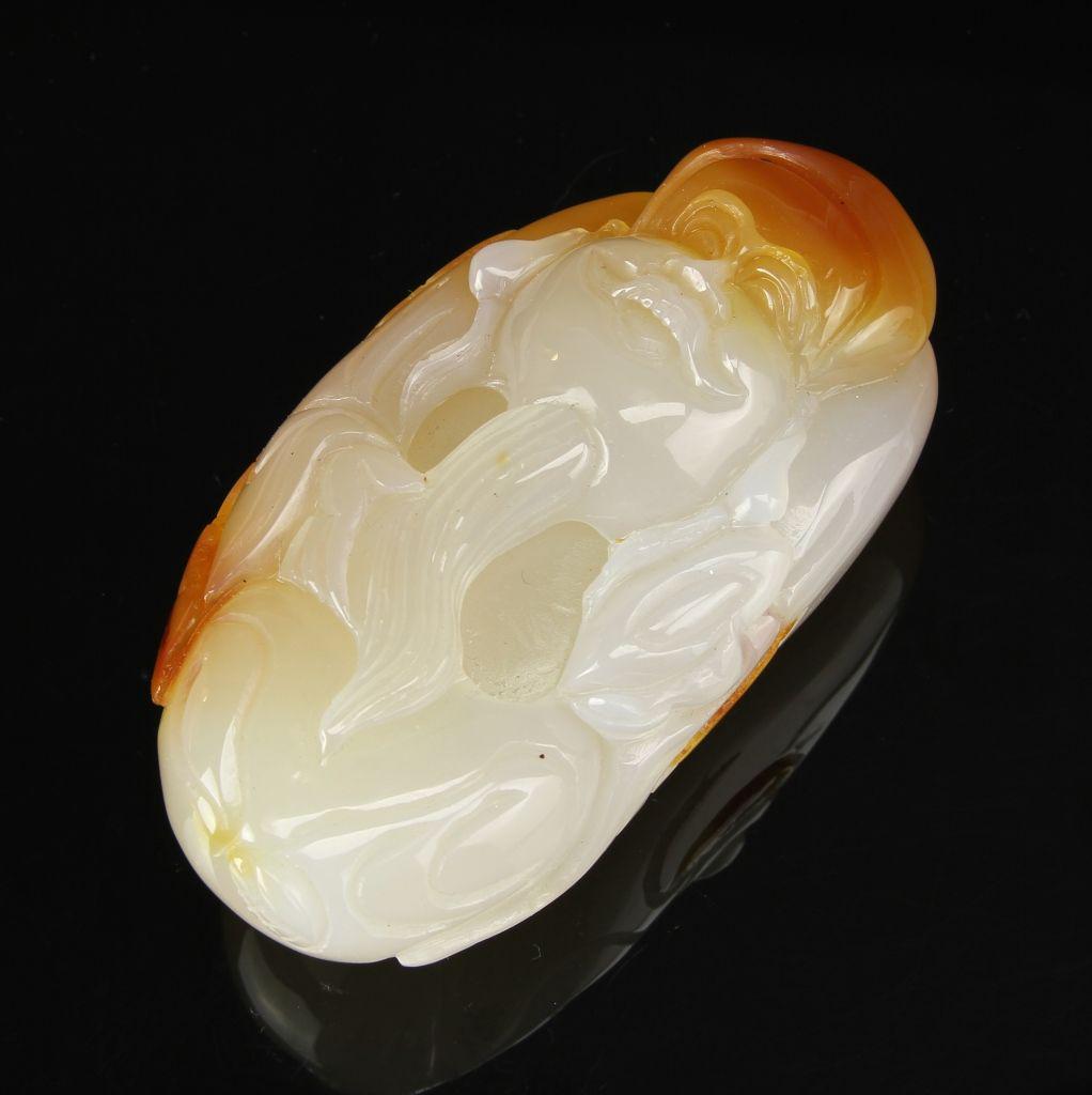 Chinese Agate Shoulao: China, agate Shoulao, deeply carved, in white and orange hues, with striations in the stone, and smooth surface. Height 3 1/2 in.