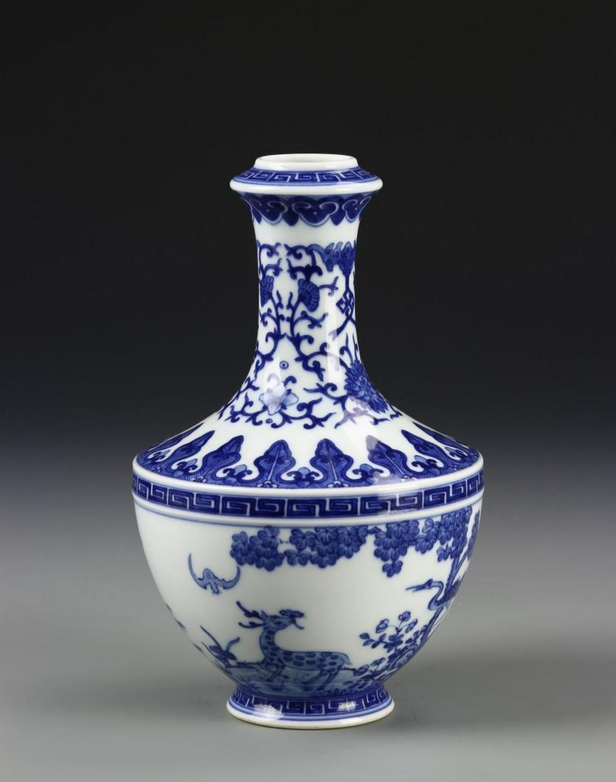 Chinese Blue and White Vase: China, ROC, blue and white vase, painted scene around the body depicting animals and bats in garden landscape, key fret borders and designs around rim, middle and base, Qianlong mark. Height 7 1/2 in.