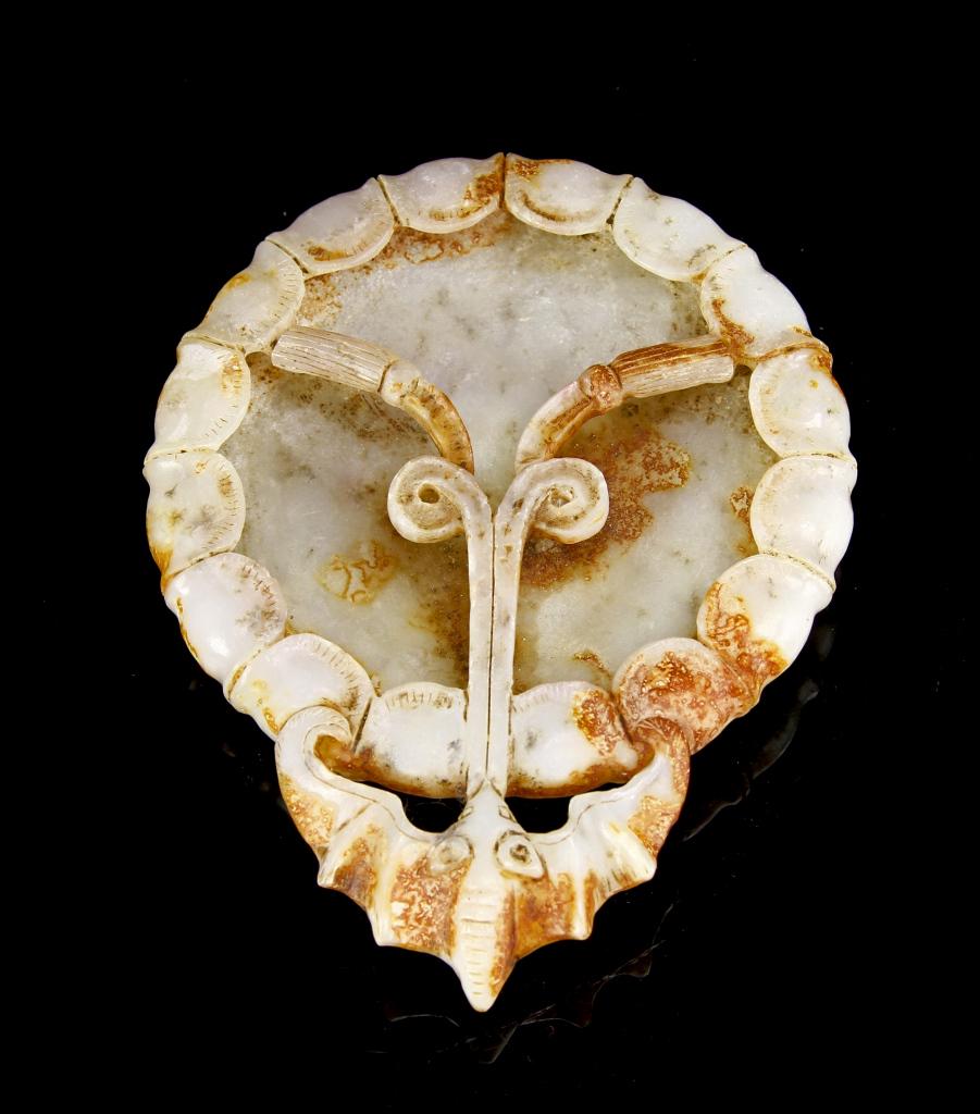Chinese Jade Brush Washer: China, Jade Brush Washer, intricately carved, a round body with a bat on one side, scalloped base and florets on the other, organic coloring of yellow, brown and white throughout. Diameter 3 1/4 in.