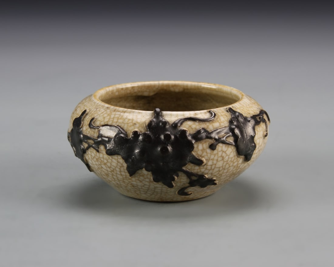 Chinese Antique Ge Yao Water Coup: China, antique Ge Yao water coup, low squat in form, crackled glaze with raised relief, of foliage designs in black hue. Height 3 1/4 in., Width 1 3/4 in.