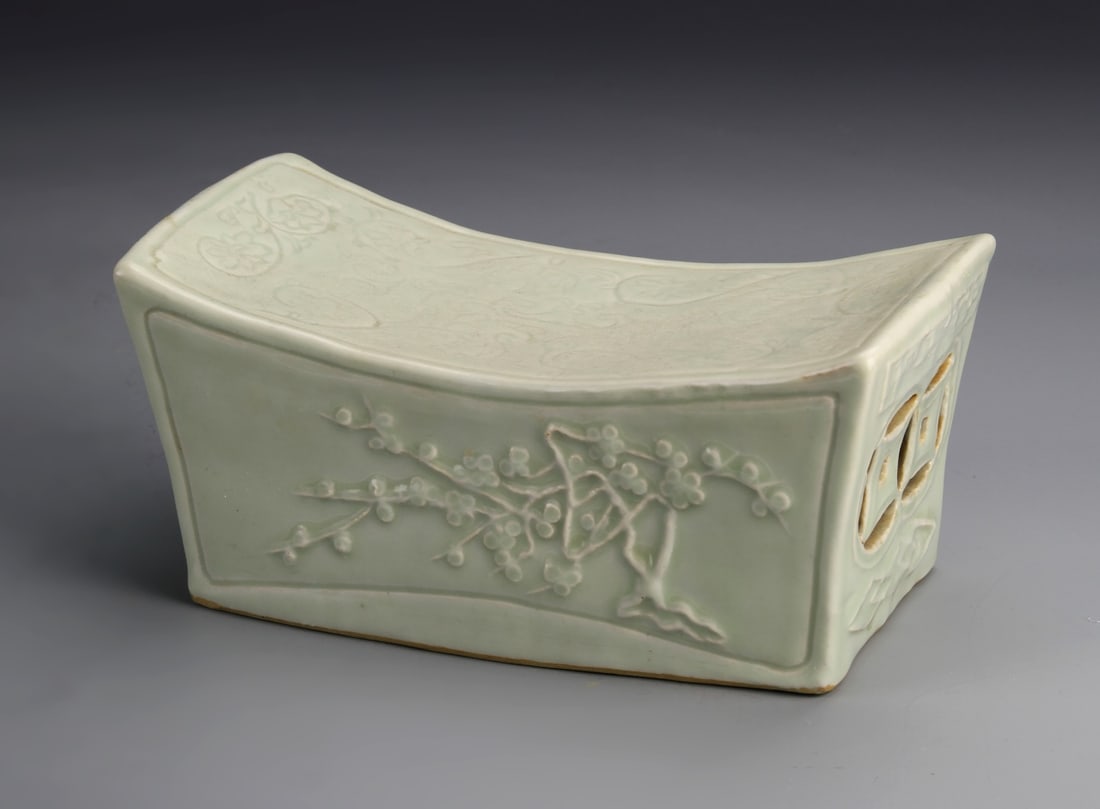 Chinese Antique Lungquan Ware Pillow: China, antique Lungquan ware pillow, in rectangular form, with curved top, featuring scrolling tree and floral motifs. Height 4 in., Length 8 1/2 in., Width 2 1/2 in.