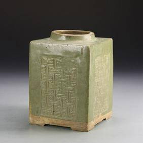 Chinese Antique Green-Glazed Tea Caddy: China, antique green-glazed tea caddy in a four sided form, with carved details across the surface, in an olive green hue, mark on base. Height 7 in., Width 4 7/8 in., Length 4 7/8 in.